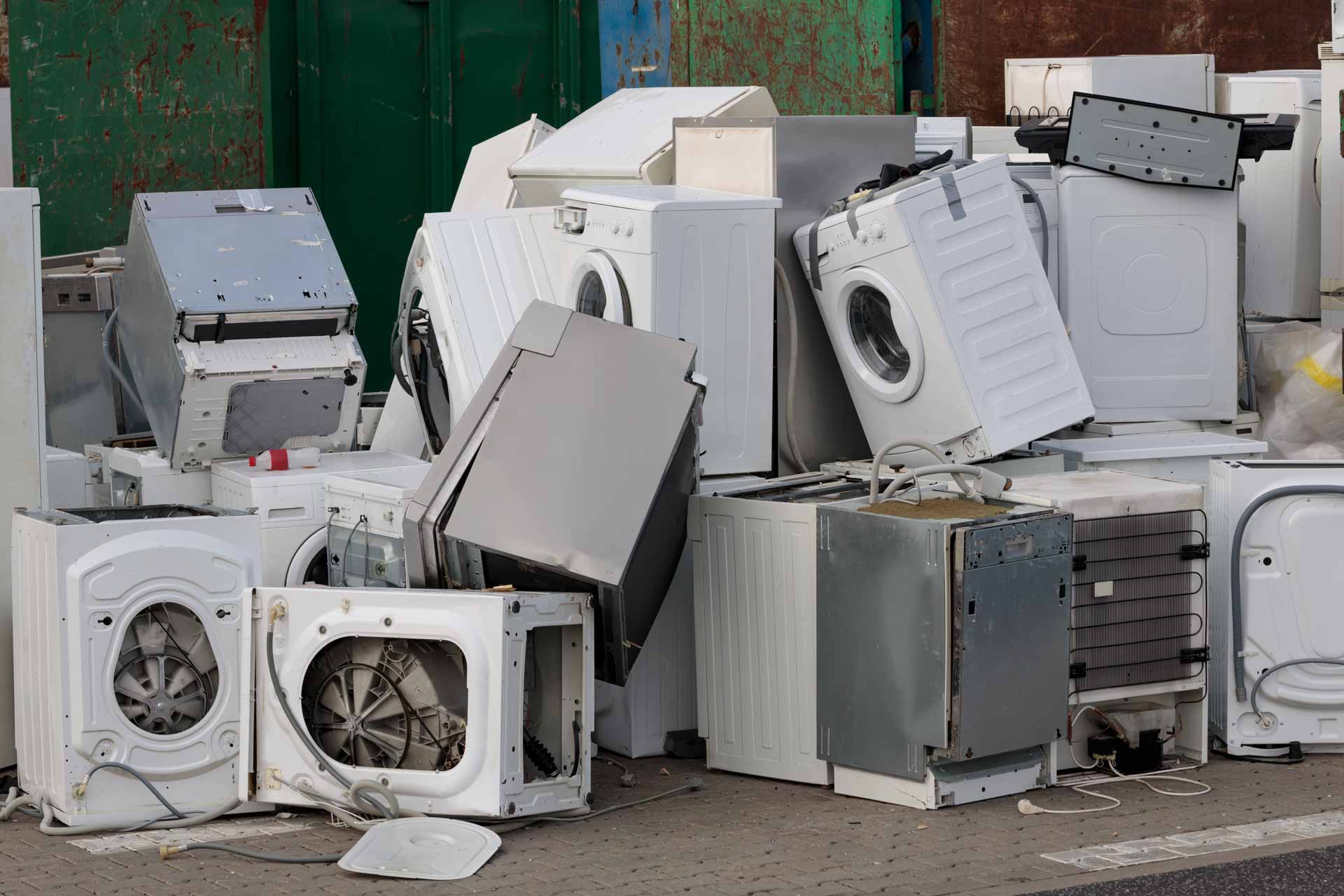 Pile of old appliances in a garbage dump