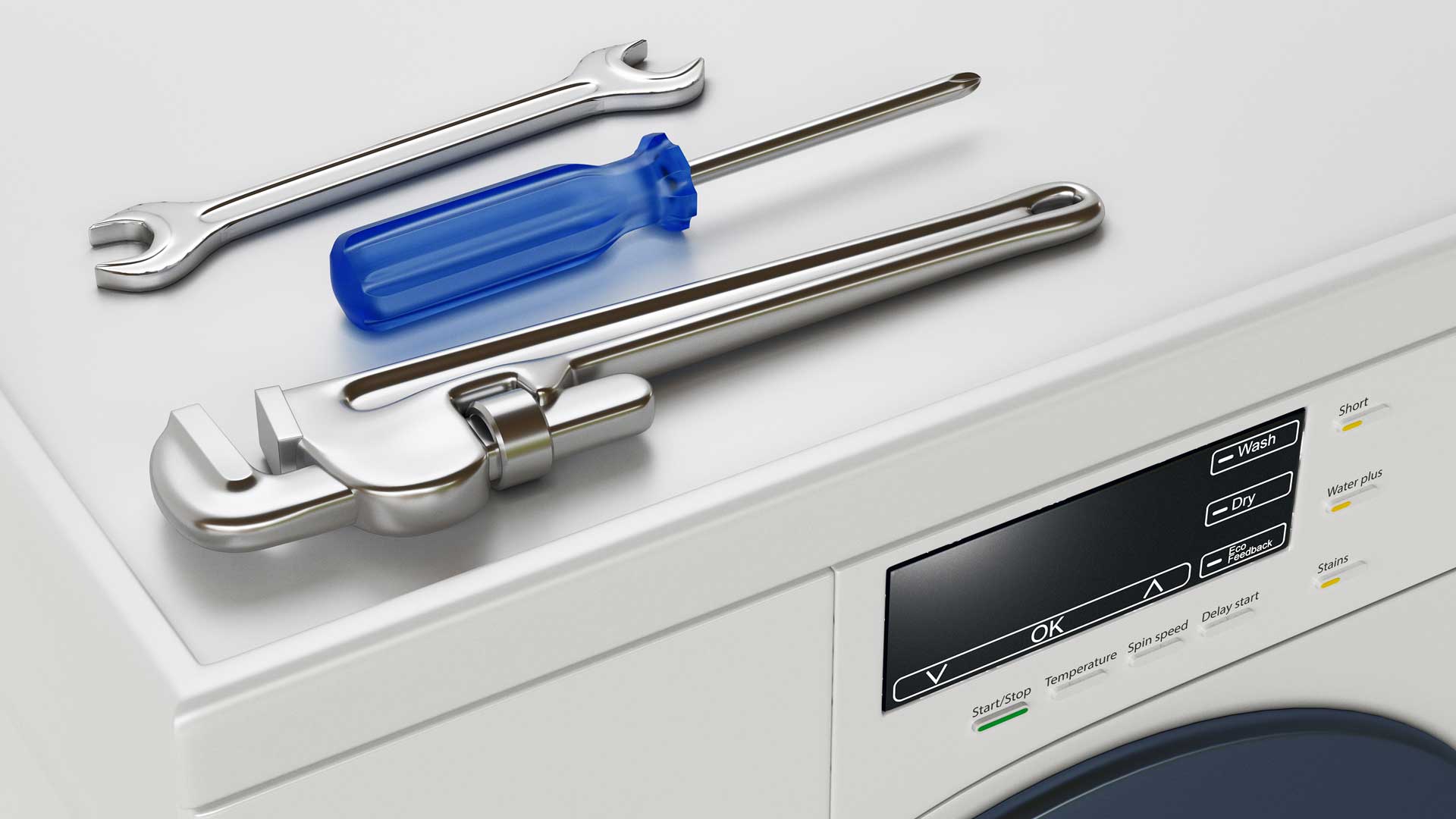 Various tools sitting atop a washer/dryer