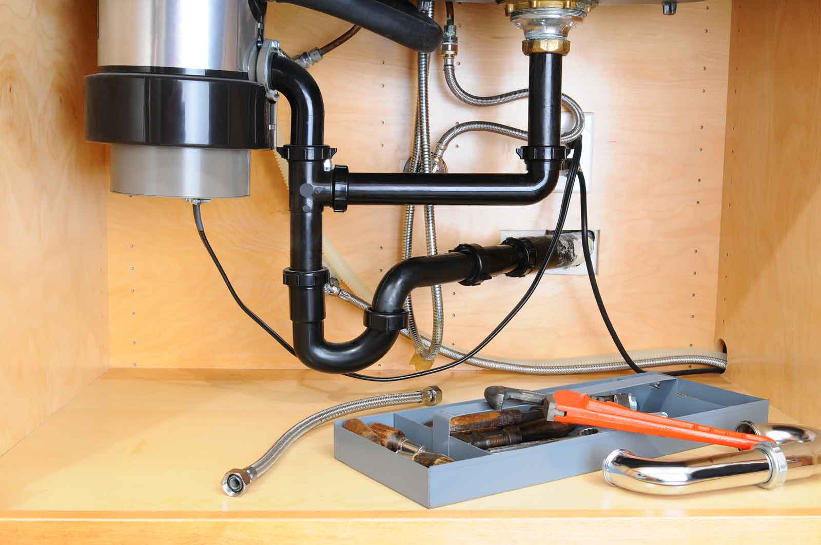 Garbage disposal under sink with tools